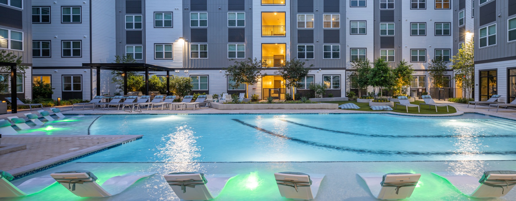 a pool in a courtyard between buildings