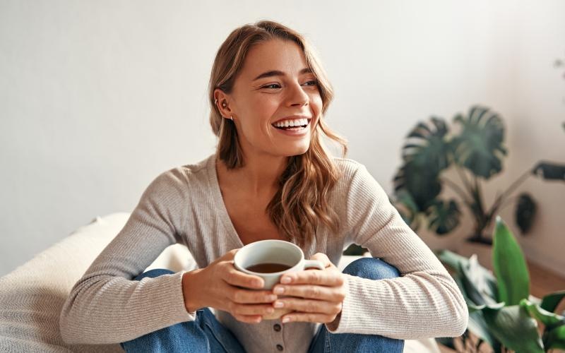 a woman holding a cup